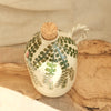 Ceramic jar with cork lid on a wooden surface